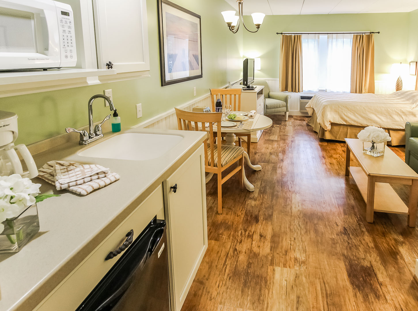 a cozy studio unit with kitchenette at VRI's Holly Tree Resort in Massachusetts.